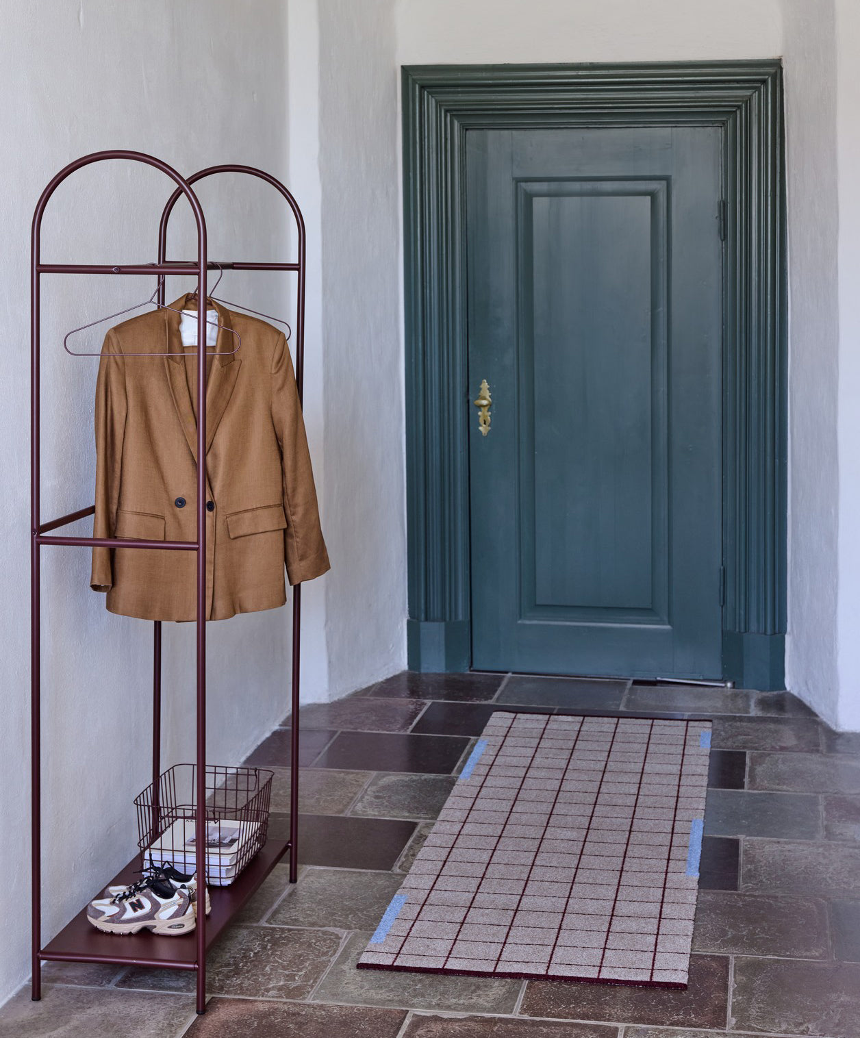 ARCH clothing rack in wine and NET runner in a hallway