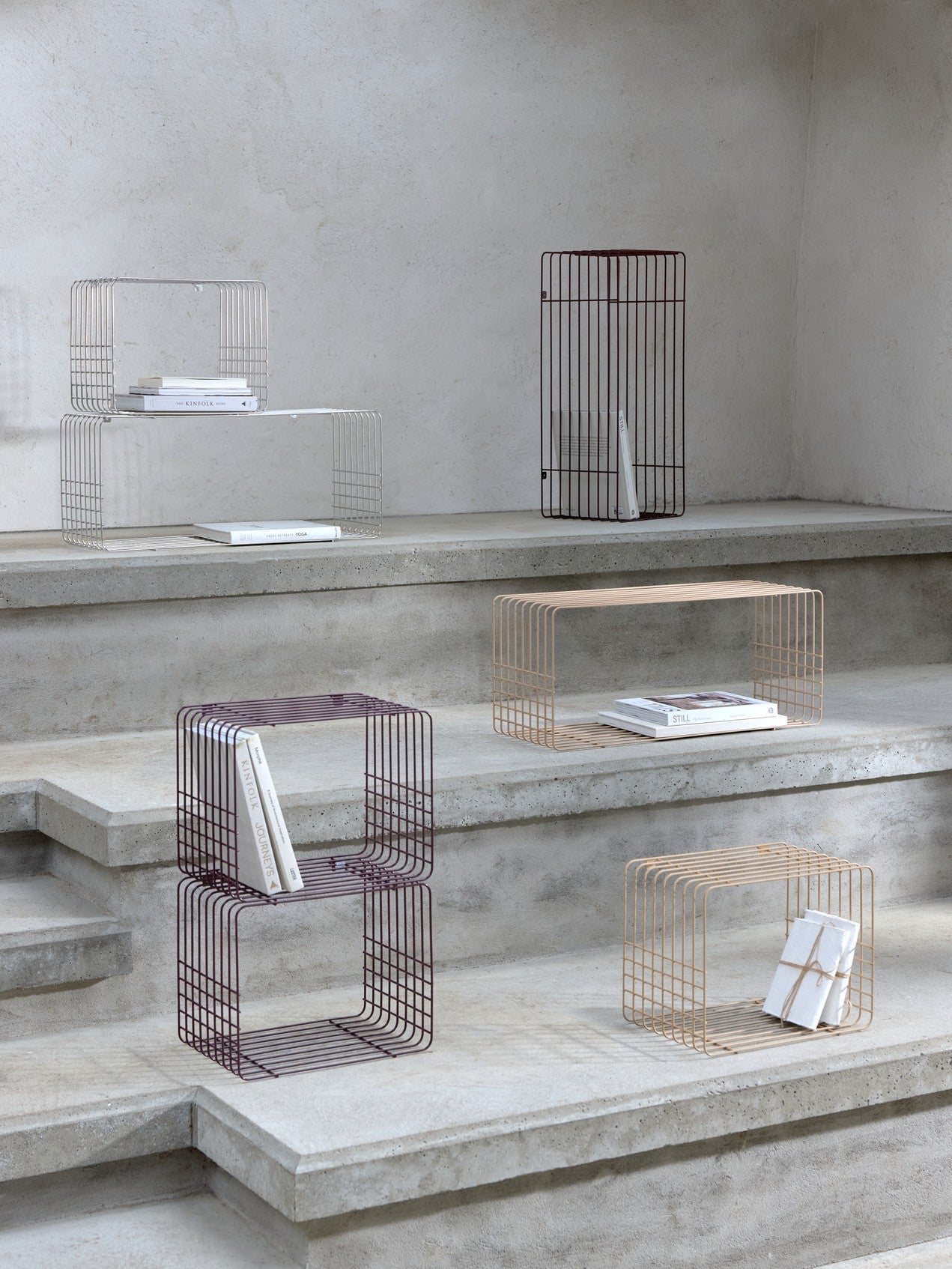 WIRE racks in six colours on concrete steps